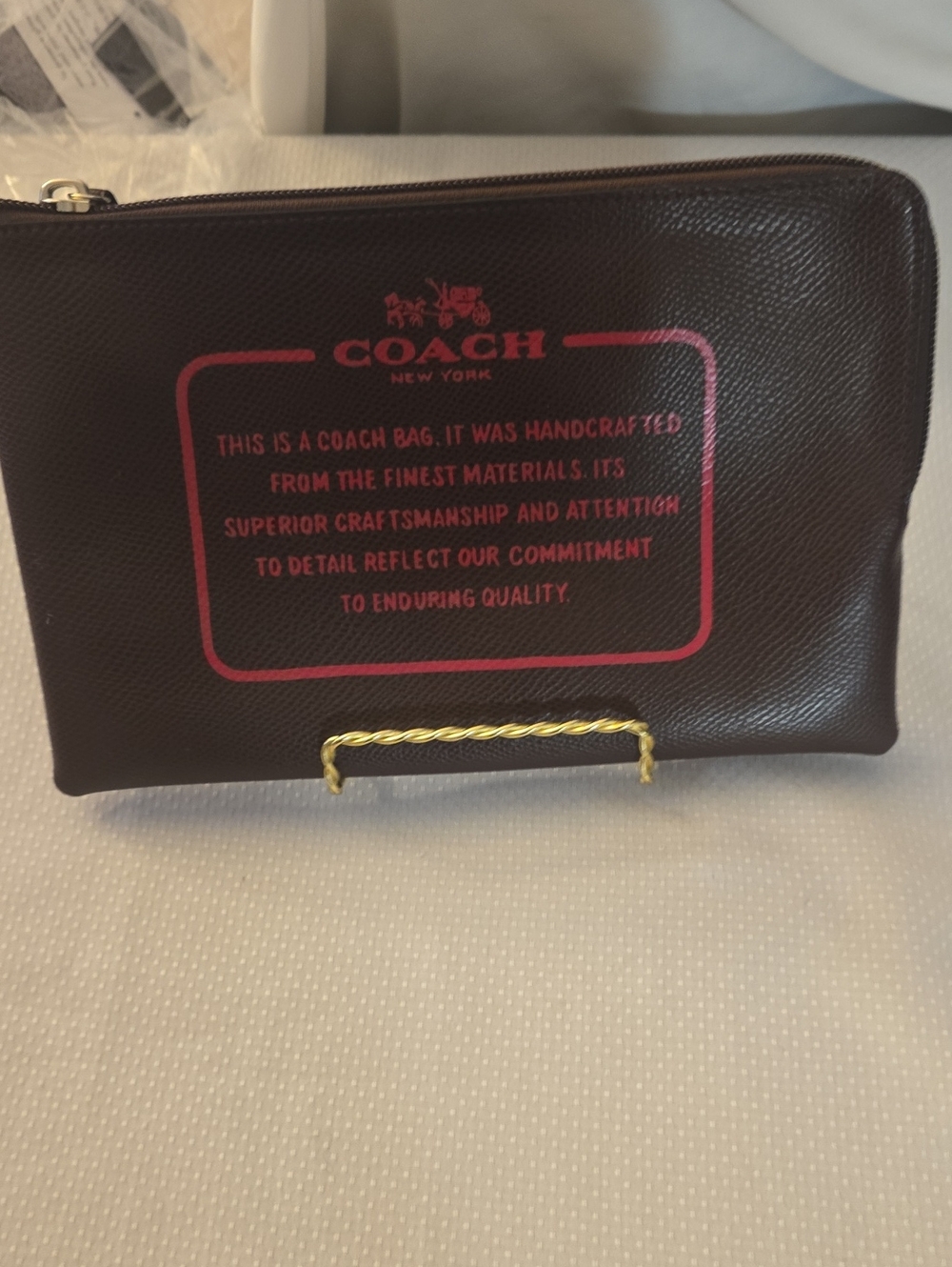 Coach Brown Leather Pouch with Pink Logo Print
